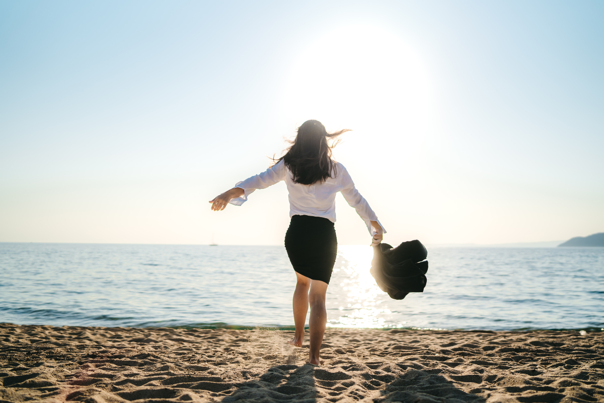 lady running gleefully on the beach