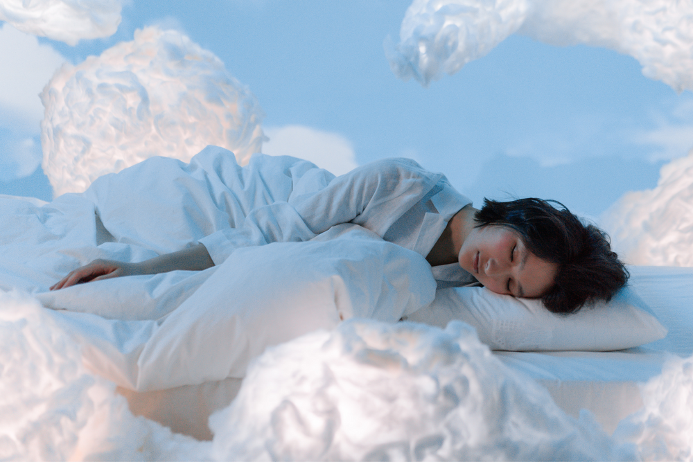 woman sleeping in clouds