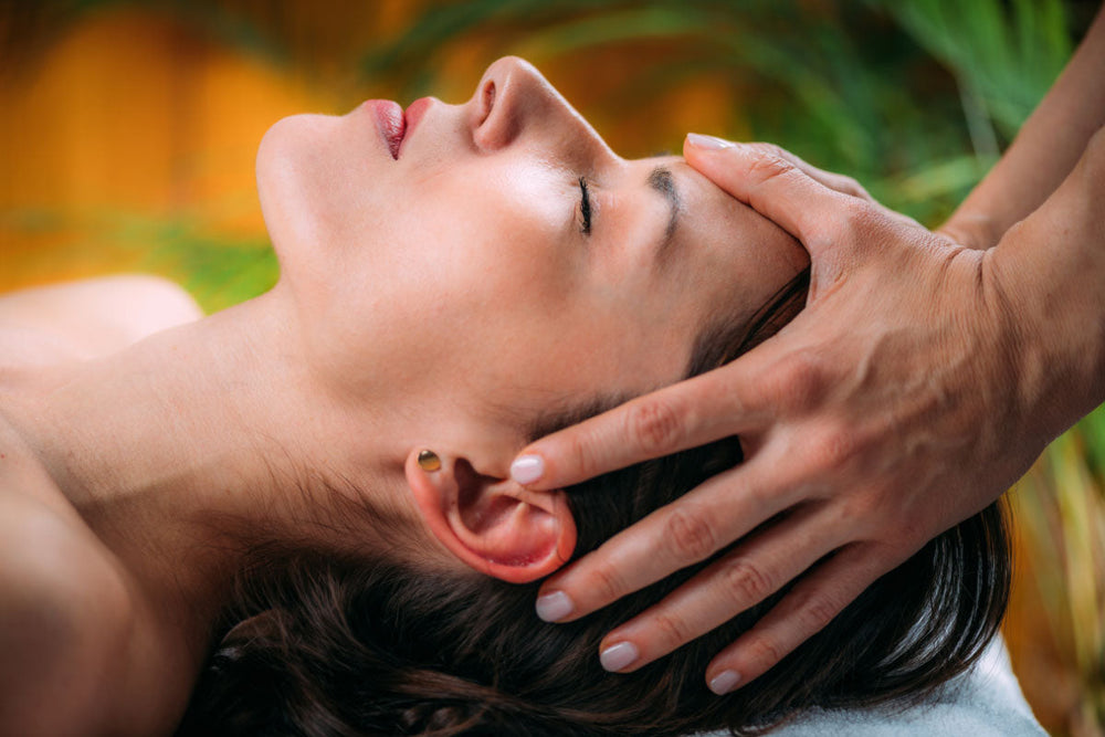 woman receiving a head massage